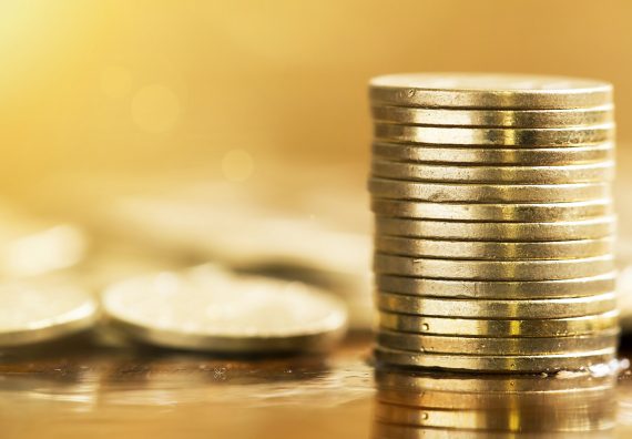 Golden coins closeup - money savings concept